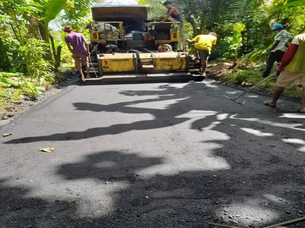 Asphalt paving on a highway road construction site